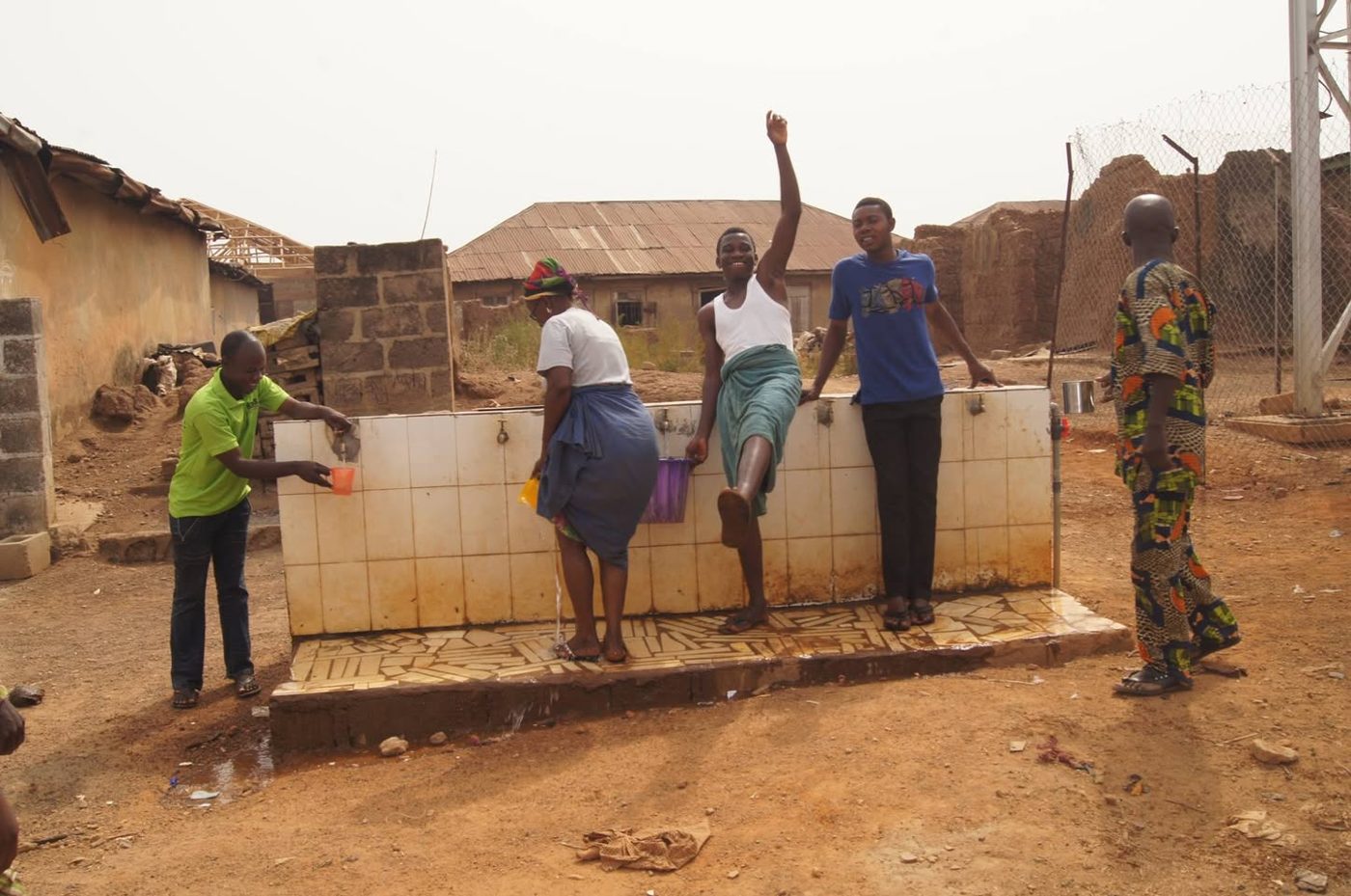Residents using the restored borehole in Okuku